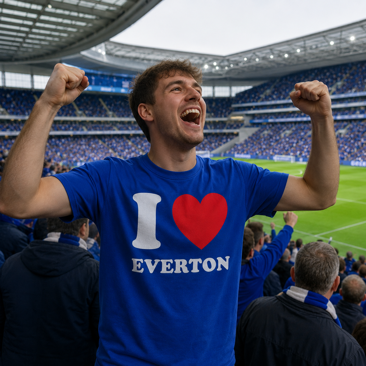 Person wearing a blue 'I ❤️ Everton' shirt in a stadium.
