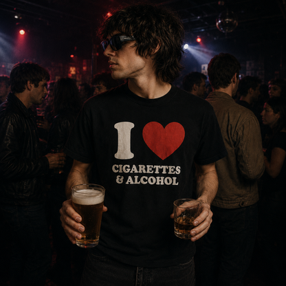 Person wearing a t-shirt with 'I ❤️ Cigarettes & Alcohol' design, holding drinks in a bar setting.